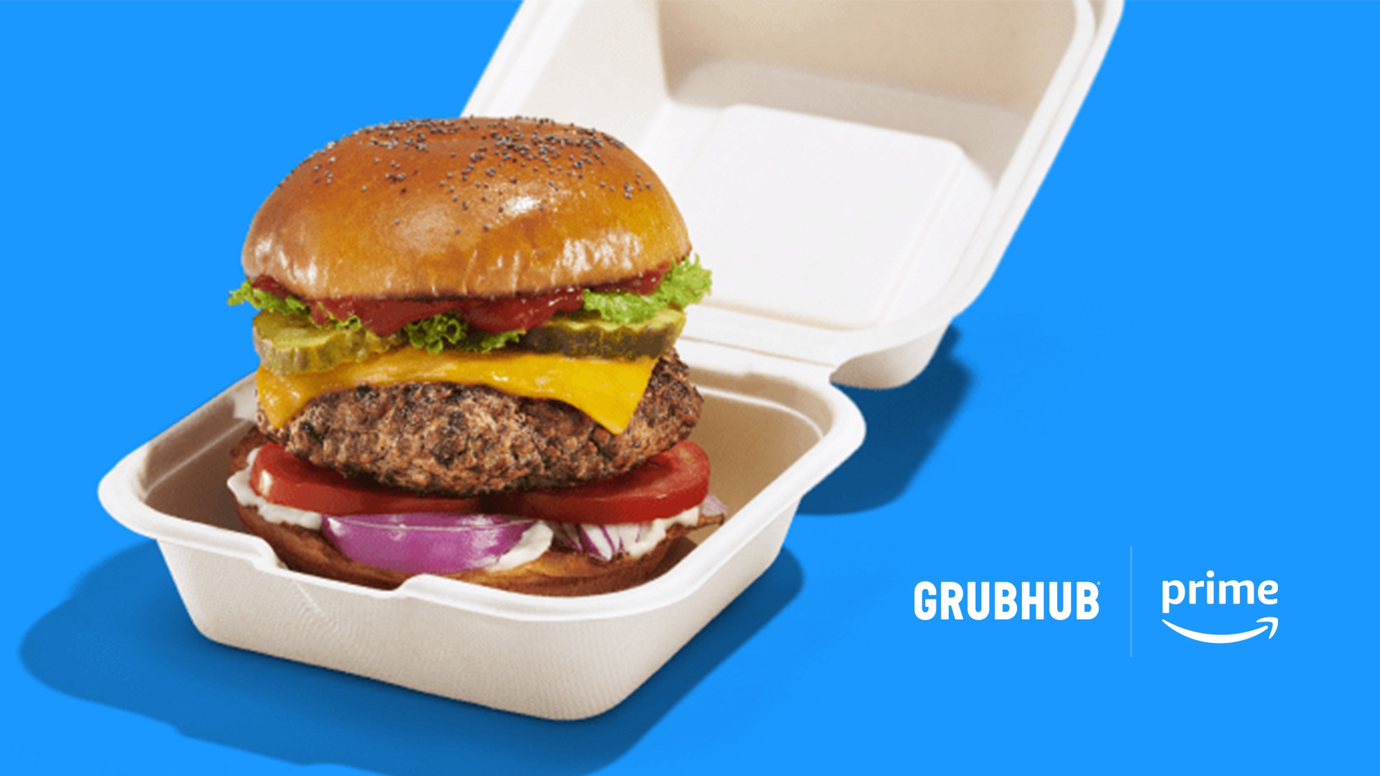 An image of a burger inside a takeaway box. There is a blue background and the Amazon and Grubhub logos on the image.