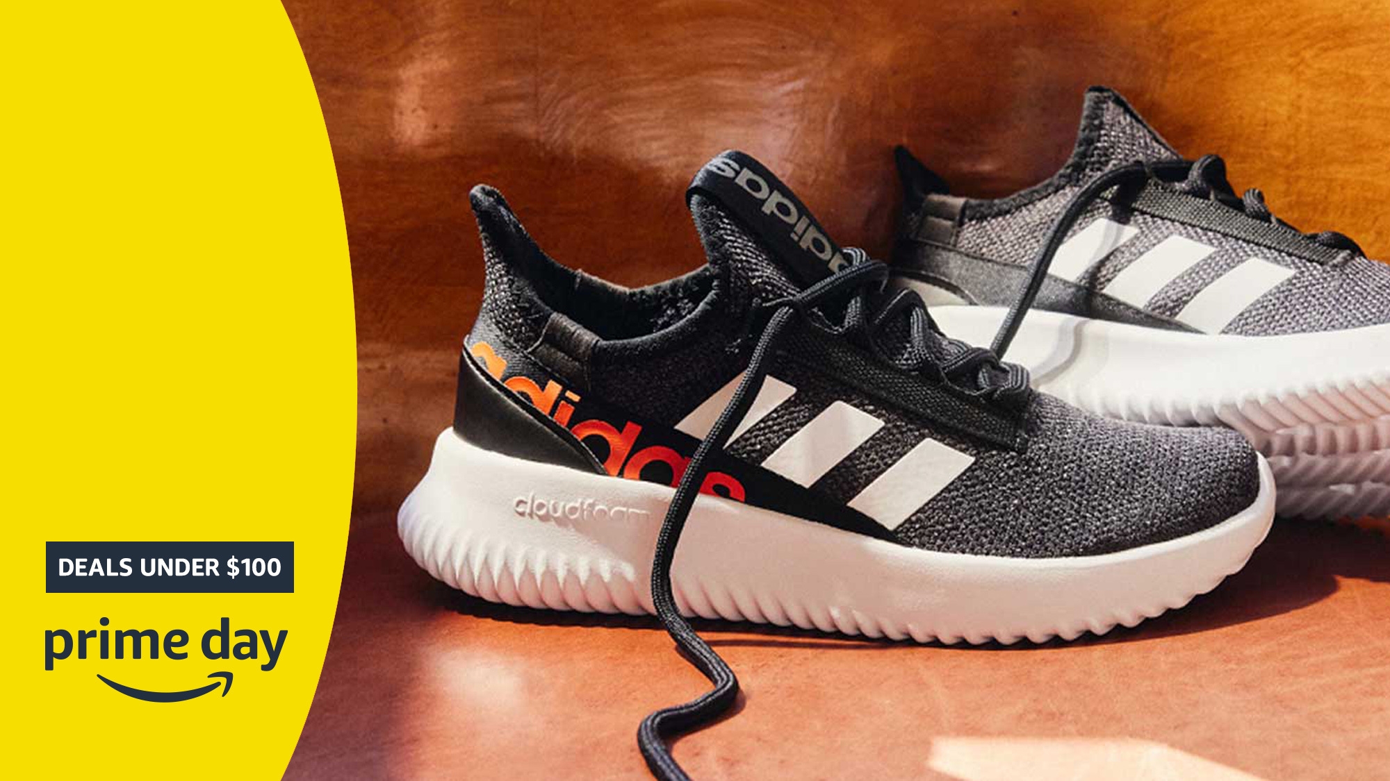 Prime Day deals under $100 image featuring black Adidas sneakers.