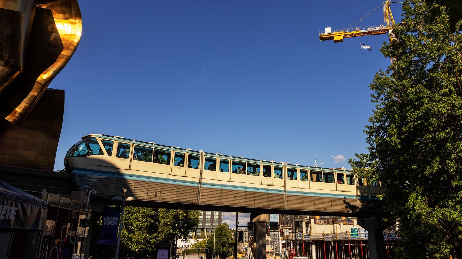 An image of the monorail train outside of Climate Pledge Arena in Seattle.