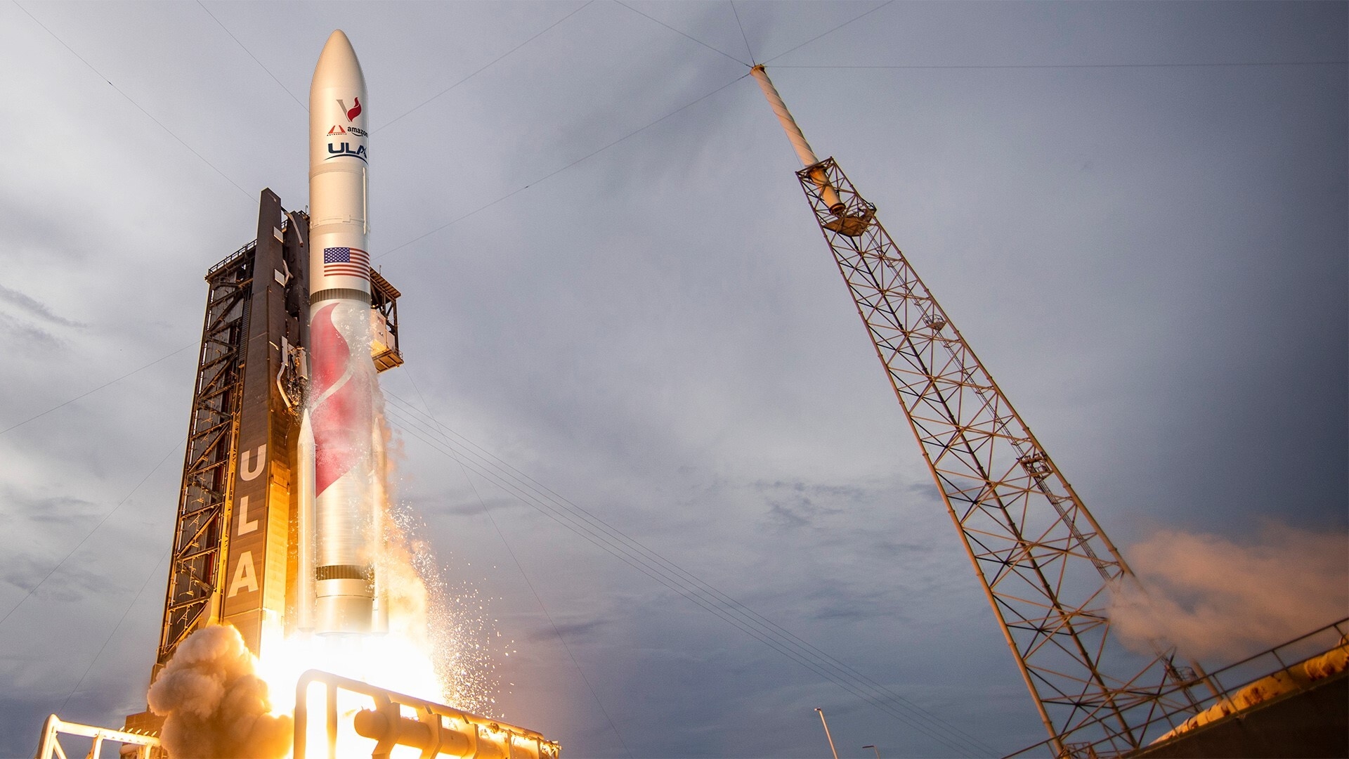 A ULA rocket takes launch into a night sky.