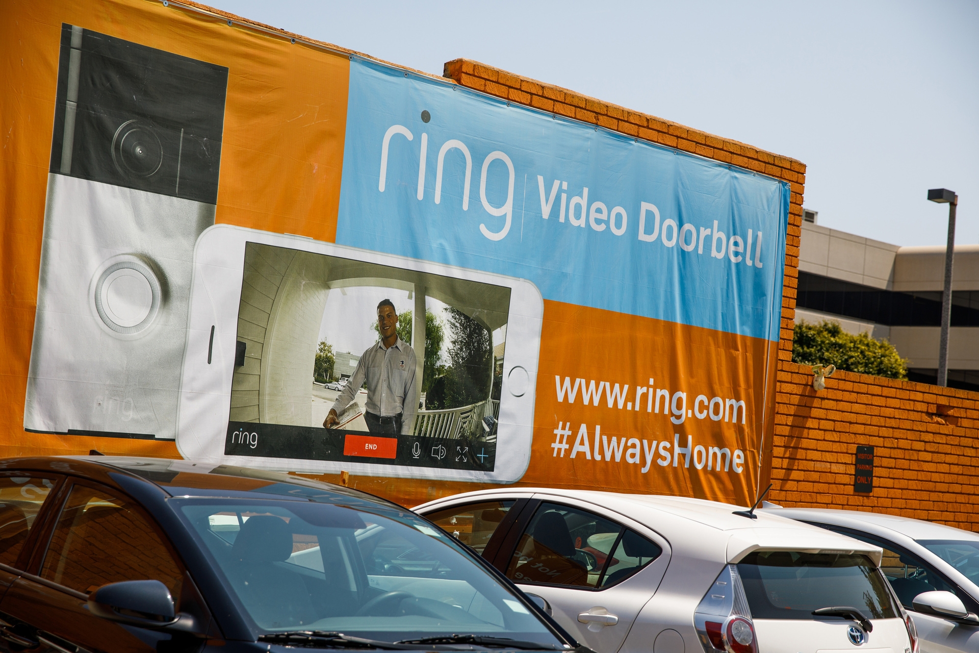A banner with a screen capture of the Ring video doorbell, with the Ring URL (www.ring.com) and the hashtag #AlwaysHome