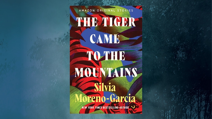 An image of a book cover for "The Tiger Came to the Mountains" by Silvia Moreno-Garcia with a blue background.