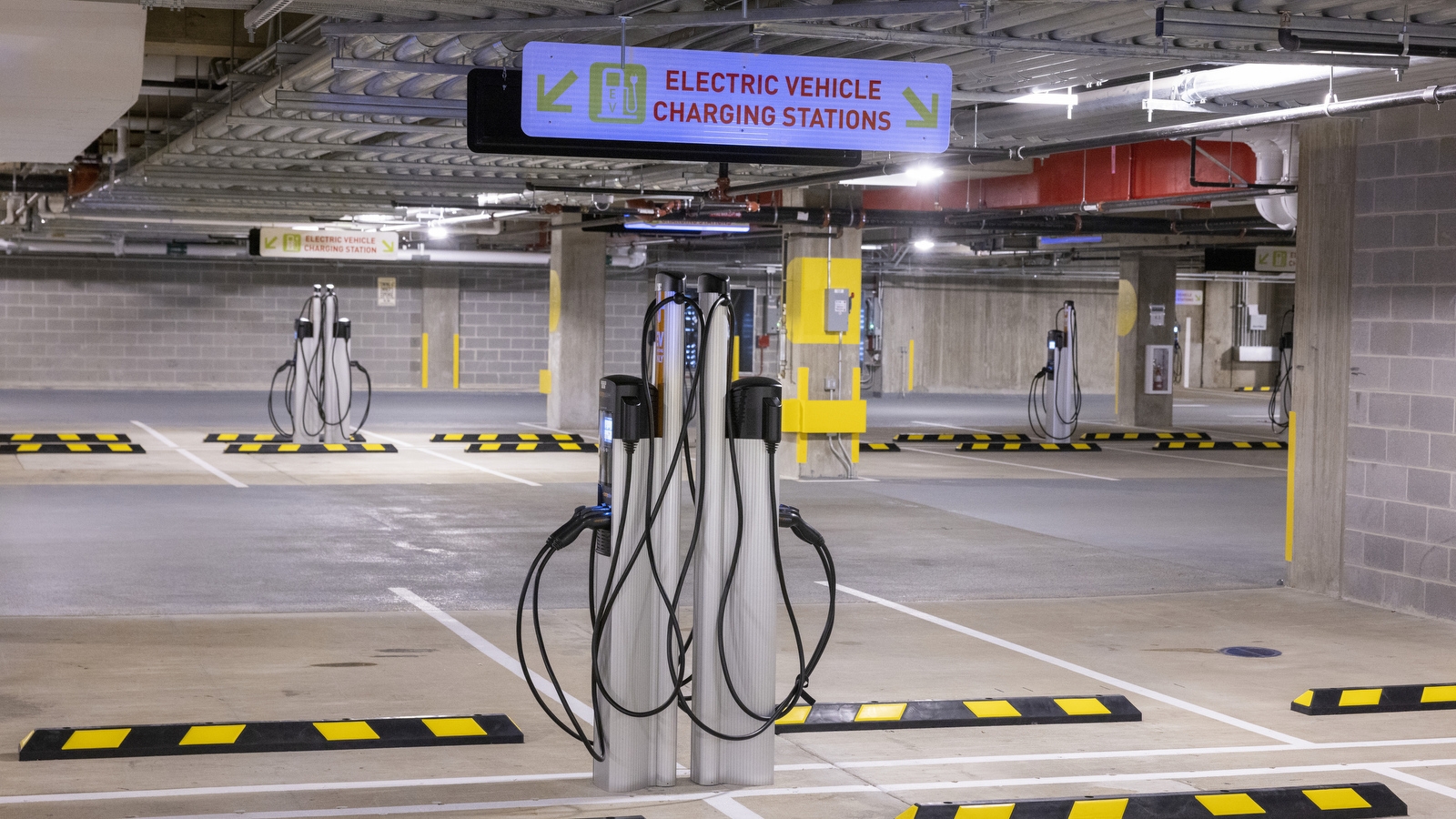 An image of electric vehicle charging stations inside the parking garage at Amazon's HQ2